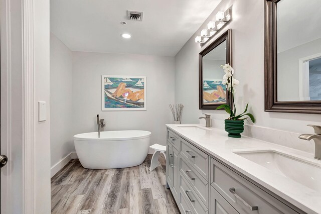 bedroom featuring ceiling fan and light hardwood / wood-style floors