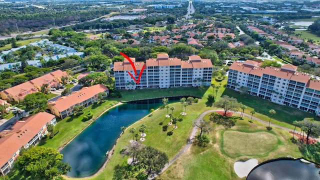 birds eye view of property with a water view