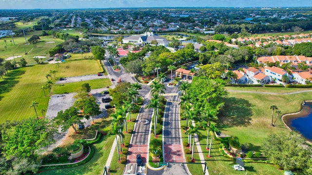 birds eye view of property with a residential view and a water view