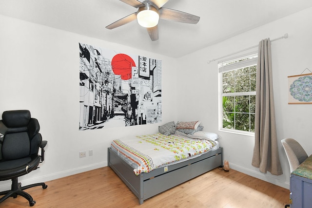 bedroom featuring ceiling fan and hardwood / wood-style flooring