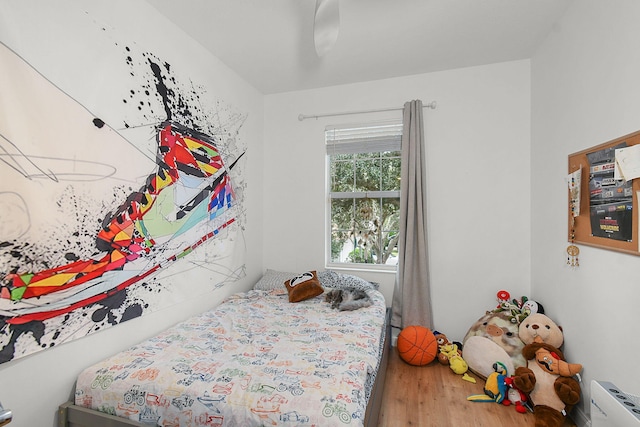 bedroom featuring ceiling fan and hardwood / wood-style flooring