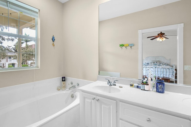 bathroom featuring a bathtub, vanity, and ceiling fan