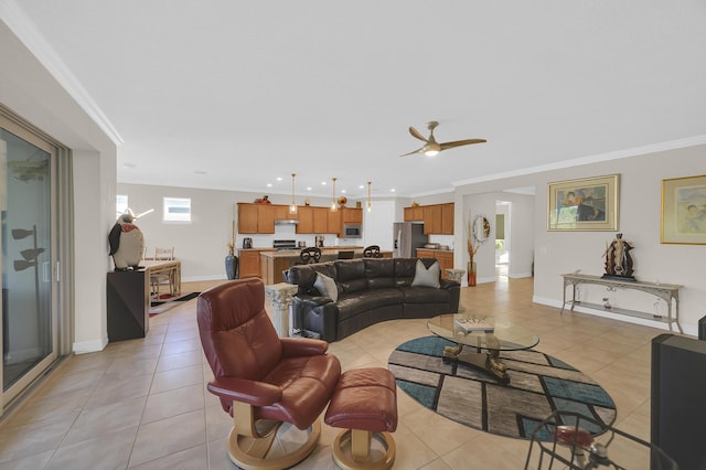 living room with ceiling fan, ornamental molding, and light tile patterned flooring