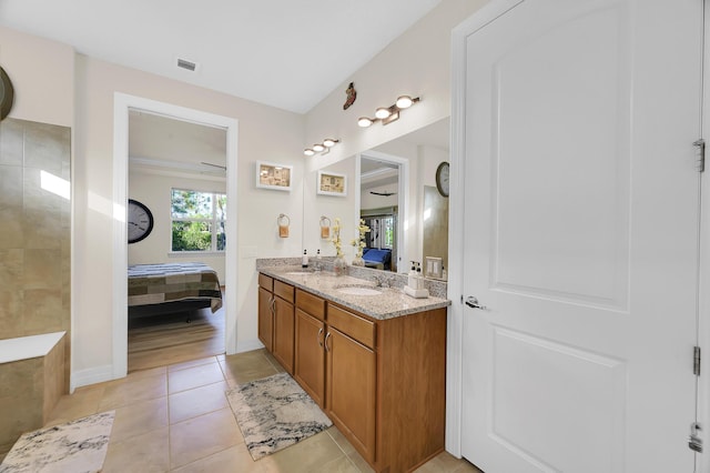 bathroom with tile patterned floors and vanity