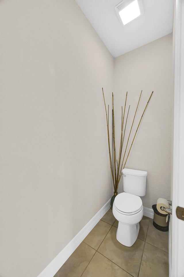 bathroom featuring toilet and tile patterned floors