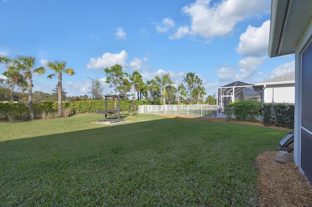 view of yard with a lanai