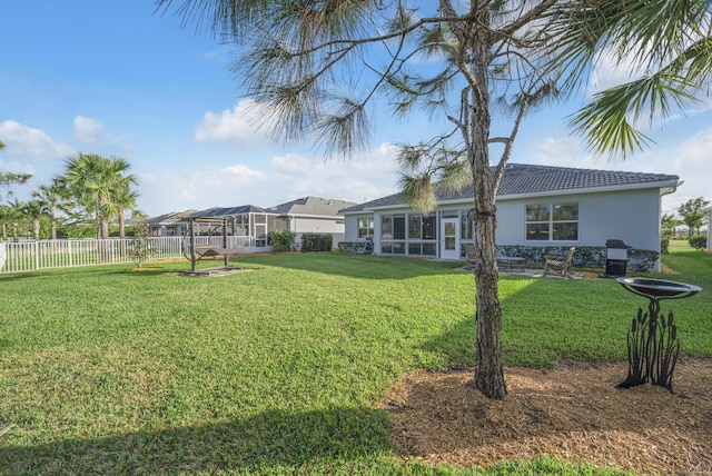 view of yard with a sunroom