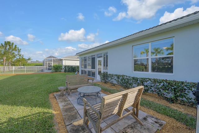 view of patio with a sunroom