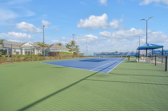 view of sport court with a gazebo and basketball hoop