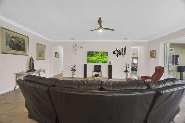 tiled living room featuring ceiling fan and crown molding