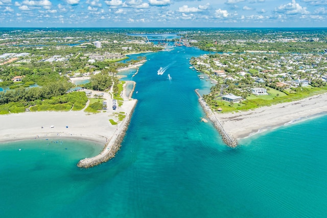 drone / aerial view with a water view and a beach view