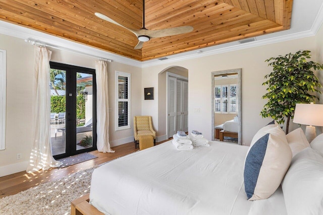 bedroom featuring wooden ceiling, access to outside, french doors, ceiling fan, and a closet