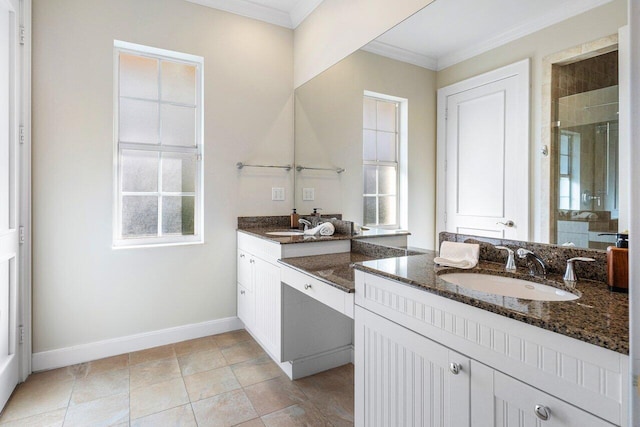 bathroom featuring an enclosed shower, vanity, a wealth of natural light, and ornamental molding