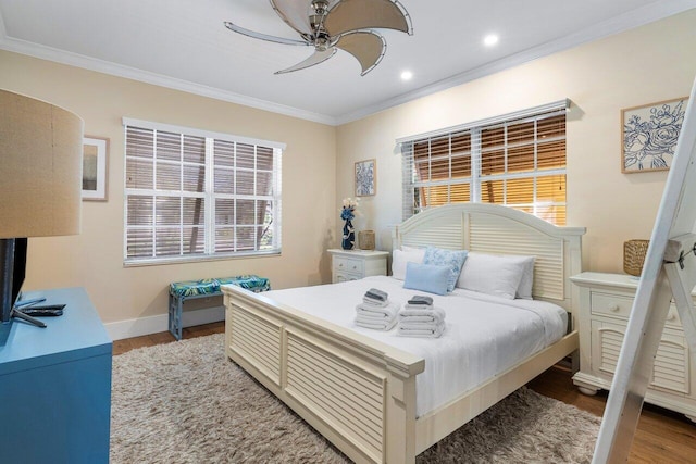 bedroom with ceiling fan, ornamental molding, and light hardwood / wood-style flooring