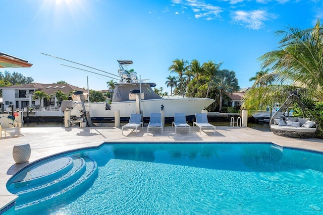 view of swimming pool featuring a patio