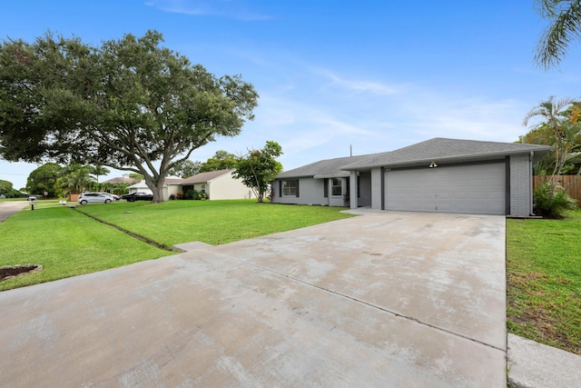 ranch-style home featuring a front yard and a garage