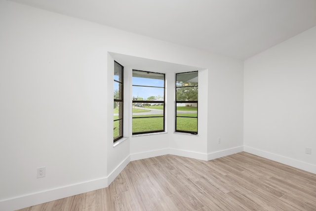 spare room with light hardwood / wood-style floors