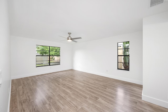 spare room with light hardwood / wood-style flooring and ceiling fan