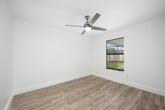 empty room featuring light hardwood / wood-style floors and ceiling fan