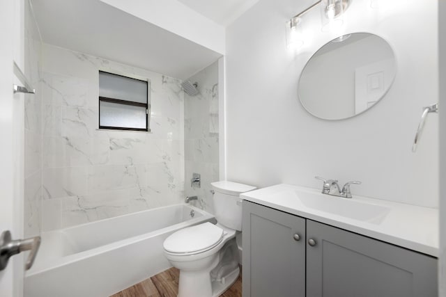 full bathroom featuring wood-type flooring, vanity, toilet, and tiled shower / bath