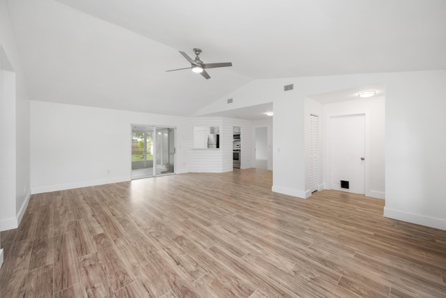 unfurnished living room featuring ceiling fan, light hardwood / wood-style flooring, and lofted ceiling