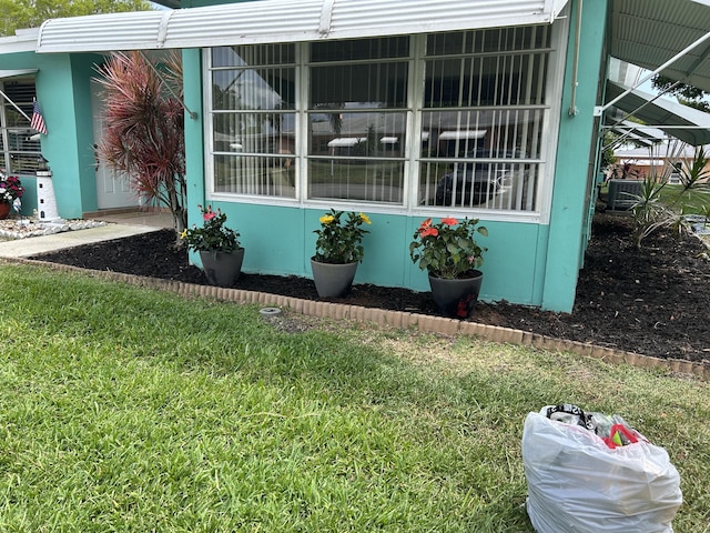 view of side of property with a yard