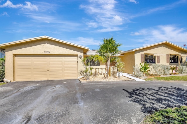 single story home with a garage