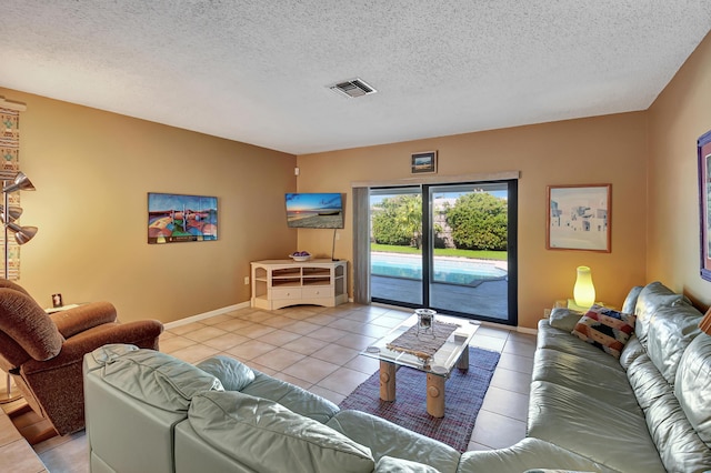 tiled living room with a textured ceiling