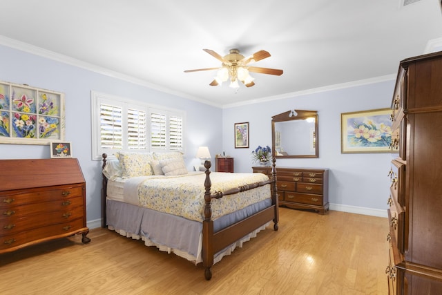 bedroom featuring ceiling fan, light hardwood / wood-style floors, and crown molding