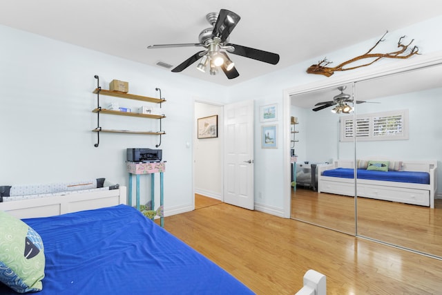 bedroom featuring a closet, ceiling fan, and hardwood / wood-style floors