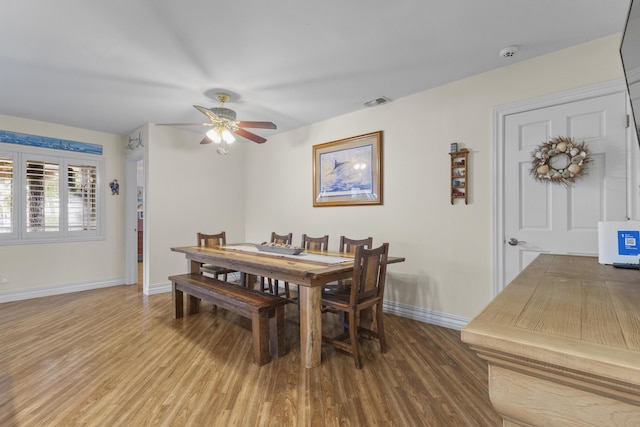 dining room featuring ceiling fan and hardwood / wood-style flooring