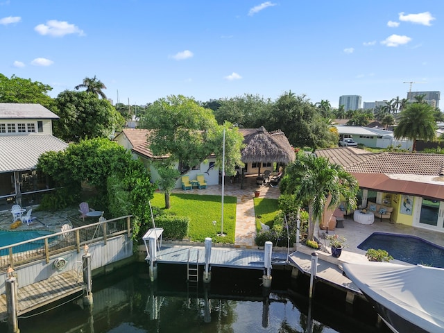 dock area with a water view and a patio area