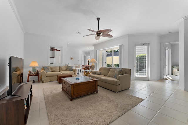 living room featuring ceiling fan, light tile patterned floors, and ornamental molding