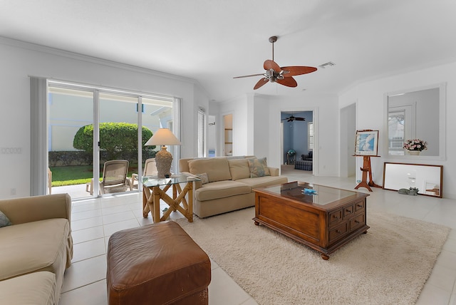 tiled living room featuring ceiling fan and crown molding