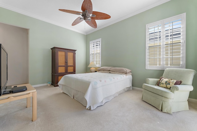 carpeted bedroom featuring ceiling fan, crown molding, and multiple windows