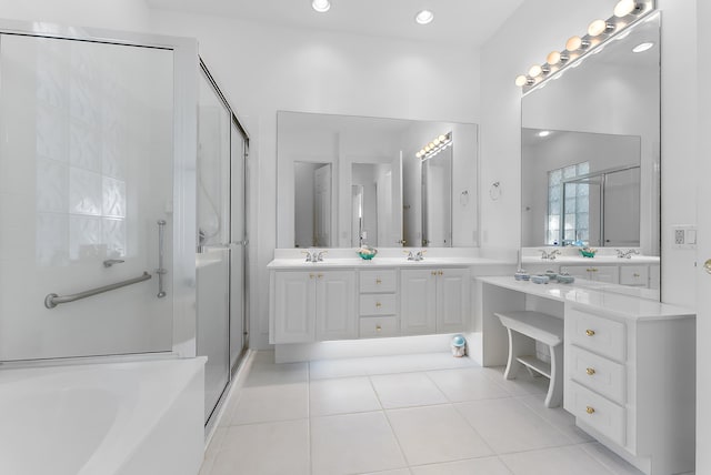 bathroom with tile patterned floors, vanity, and independent shower and bath