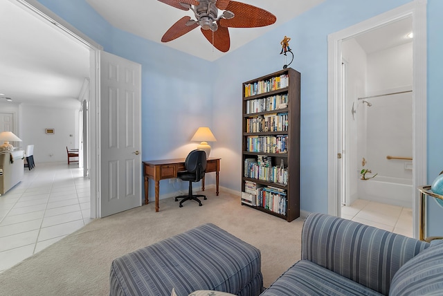 home office featuring ceiling fan and light carpet