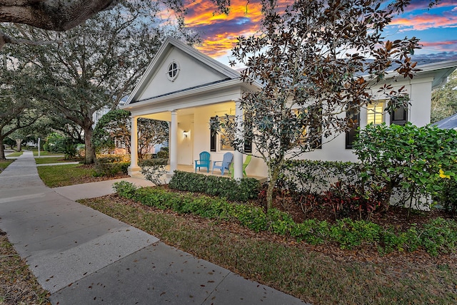 greek revival inspired property with covered porch