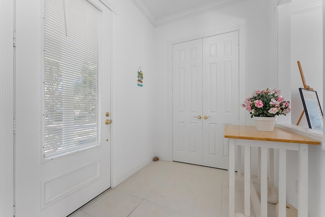 doorway to outside with a healthy amount of sunlight, light tile patterned floors, and crown molding