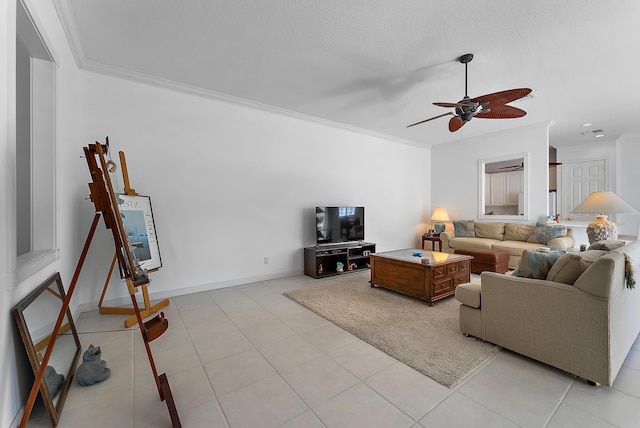 tiled living room with a textured ceiling, ceiling fan, and ornamental molding