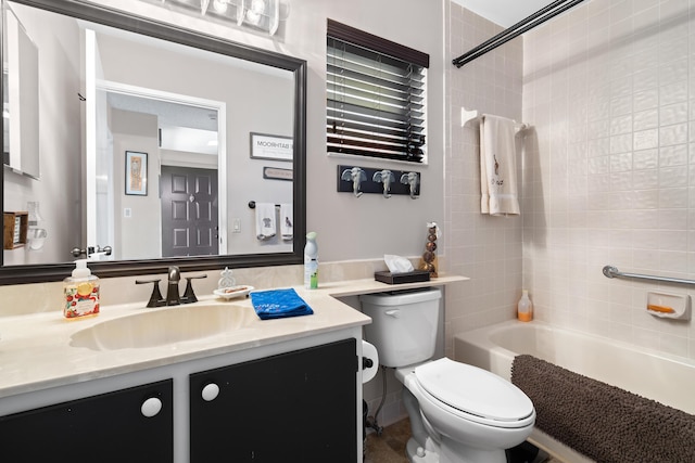 full bathroom featuring toilet, vanity, and tiled shower / bath combo