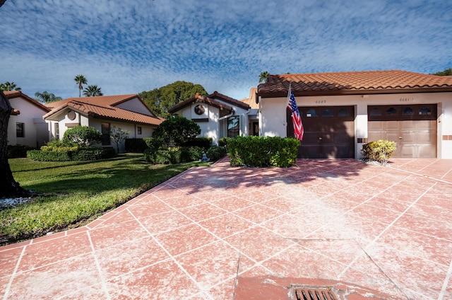 mediterranean / spanish-style home featuring a front yard