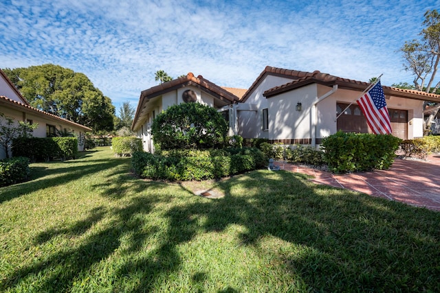 view of side of property with a yard