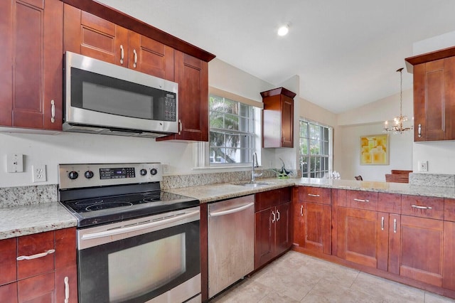 kitchen featuring sink, vaulted ceiling, light stone counters, stainless steel appliances, and a chandelier