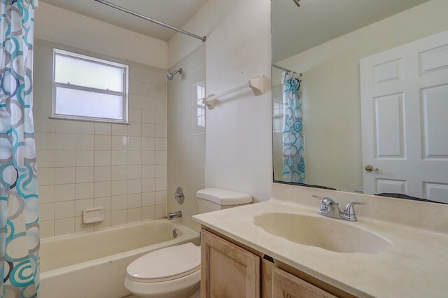 full bathroom with shower / tub combo with curtain, vanity, and toilet