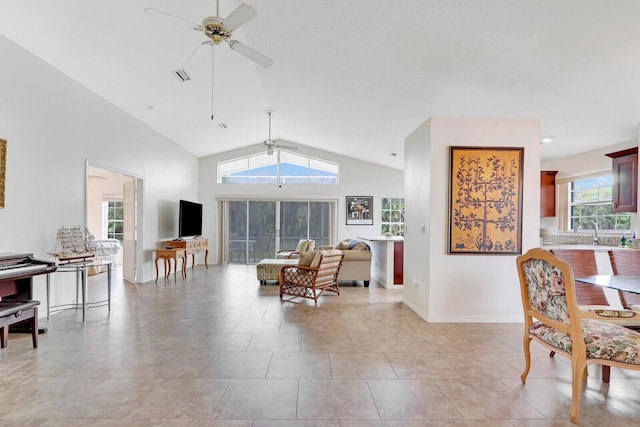 living room featuring high vaulted ceiling and ceiling fan