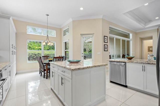 kitchen with dishwasher, a notable chandelier, a center island, white cabinetry, and hanging light fixtures