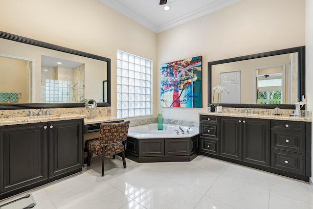 bathroom with a wealth of natural light, tile patterned floors, and vanity