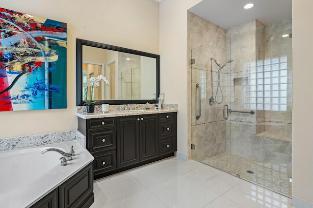 bathroom featuring tile patterned floors, vanity, and independent shower and bath