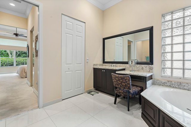 bathroom featuring a bath, ornamental molding, tile patterned flooring, and vanity